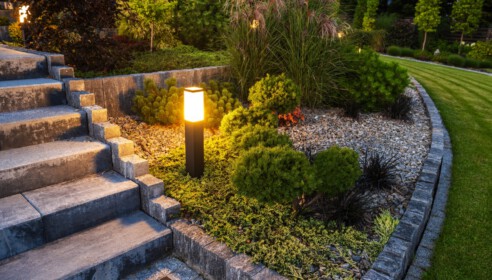 LED Outdoor Light Post in a Beautiful Residential Rockery Garden. Landscaping Industry Theme.
